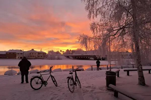 Winter Sunset Over Frozen River in Oulu, Finland
