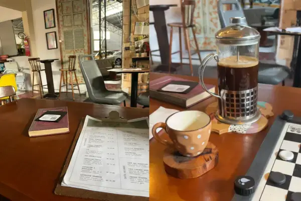 Mesa com menu e café na prensa francesa no Café Krambeck, em Barbacena.